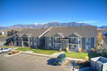 An apartment building with mountains in the background